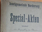 Das Bild zeigt ein altes Plakat mit Aufschrift Spezial-Akten