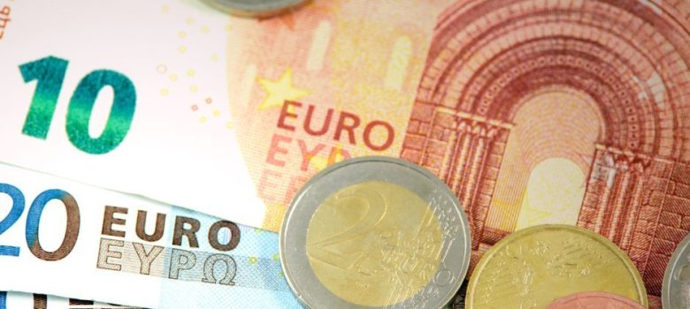 The picture shows banknotes and coins